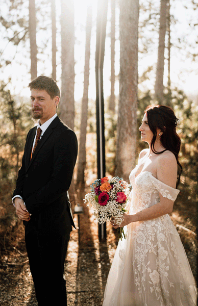 bride and groom at Pinewood wedding and events having their first look.
