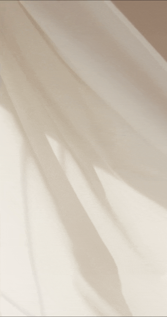 Close-up of white pleated curtains casting soft shadows, creating a tranquil and welcoming atmosphere for an online yoga space.