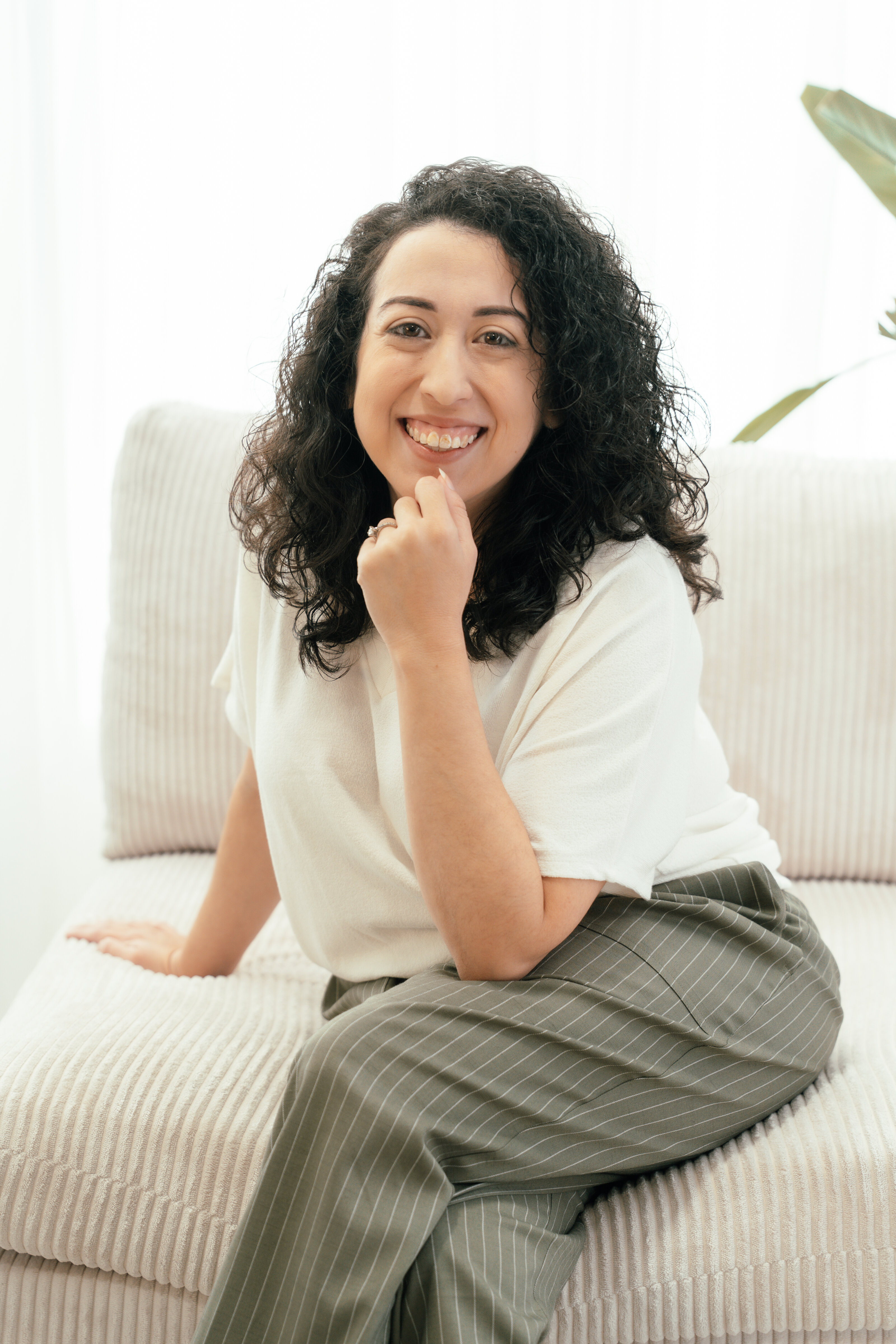 Alanna Esquejo LMFT smiling, trauma-informed and neurodivergent-affirming therapist in the East Bay Area