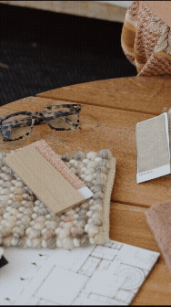 Timber coffee table with soft colured materials swatches and floor plan for a interior design project