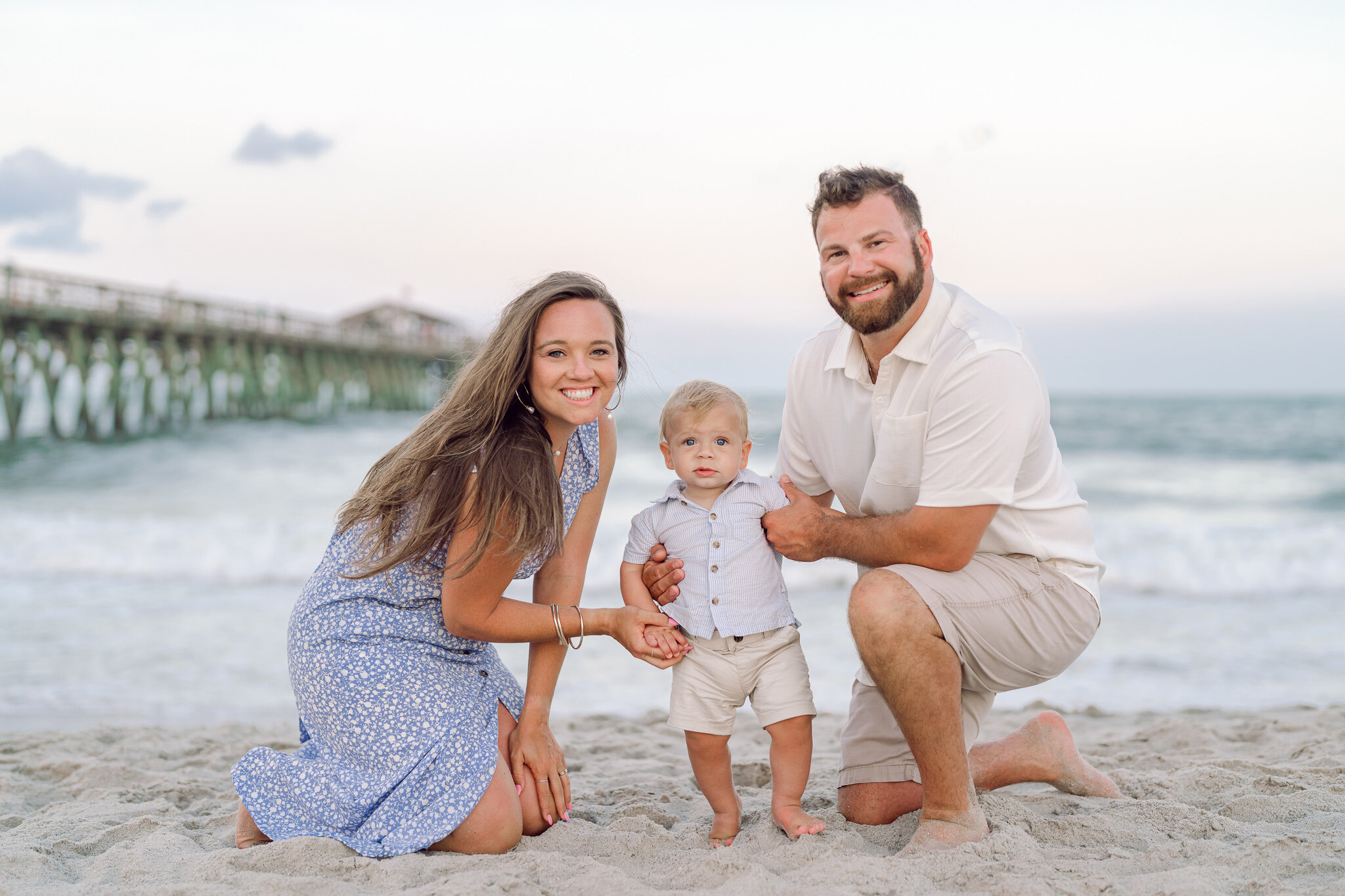 Myrtle Beach family photographers capturing family walking along shoreline