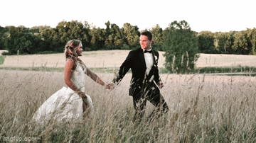 Husband and wife running in a field