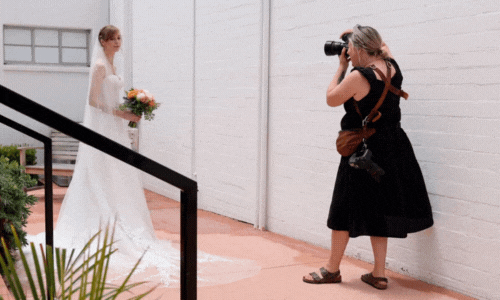 Katherine taking photos of a bride