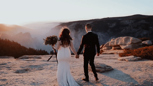 bride & groom on the edge of a cliff at yosemite