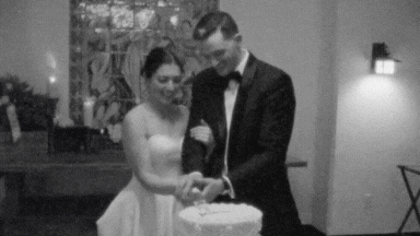 Super 8 film of a bride and groom cutting their cake at their winter wedding at Willowdale Estate — captured by a vintage wedding videographer at Castillo Holliday Photo + Film.