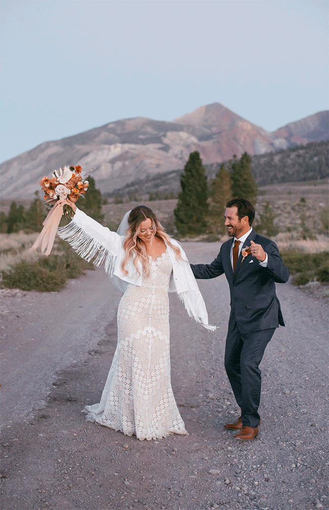 A bride and groom dance while in view of the mountains at Mammoth Lakes on their wedding day. 