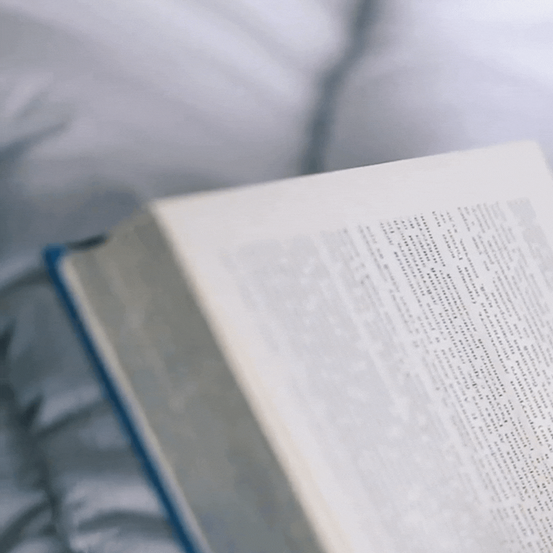 Open book on bedspread