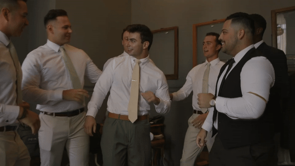 groom with groomsmen by miami wedding videographer