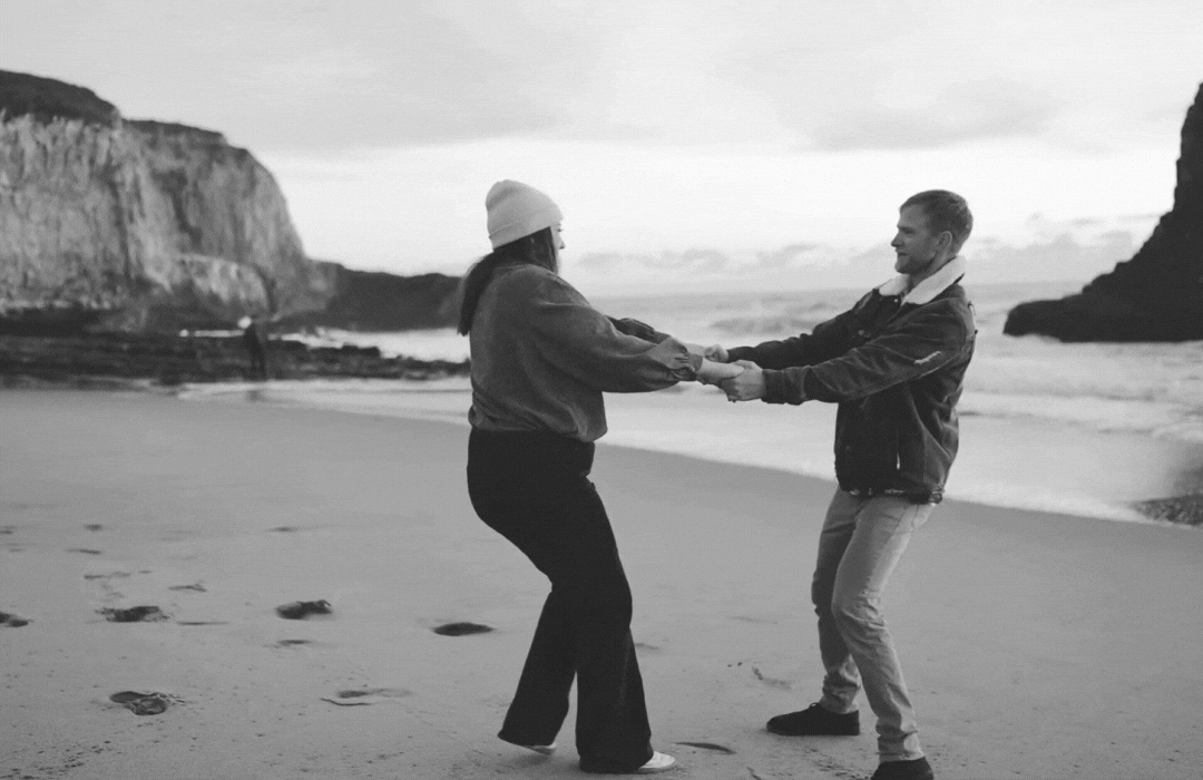 gif of couple dancing on beach