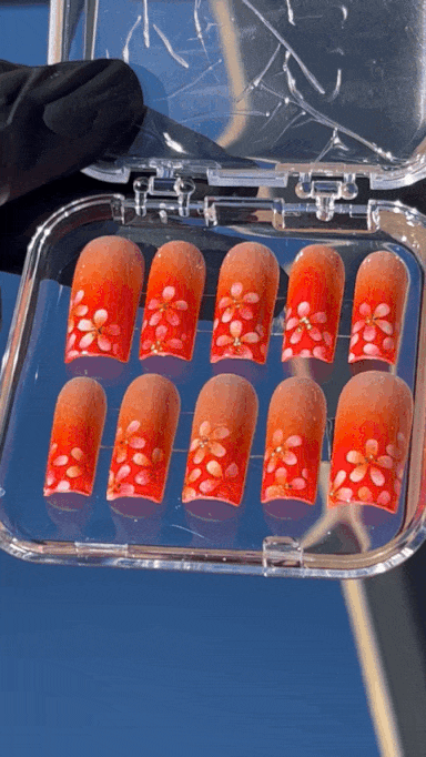 A nail tech sculpts a nail in a private nail salon