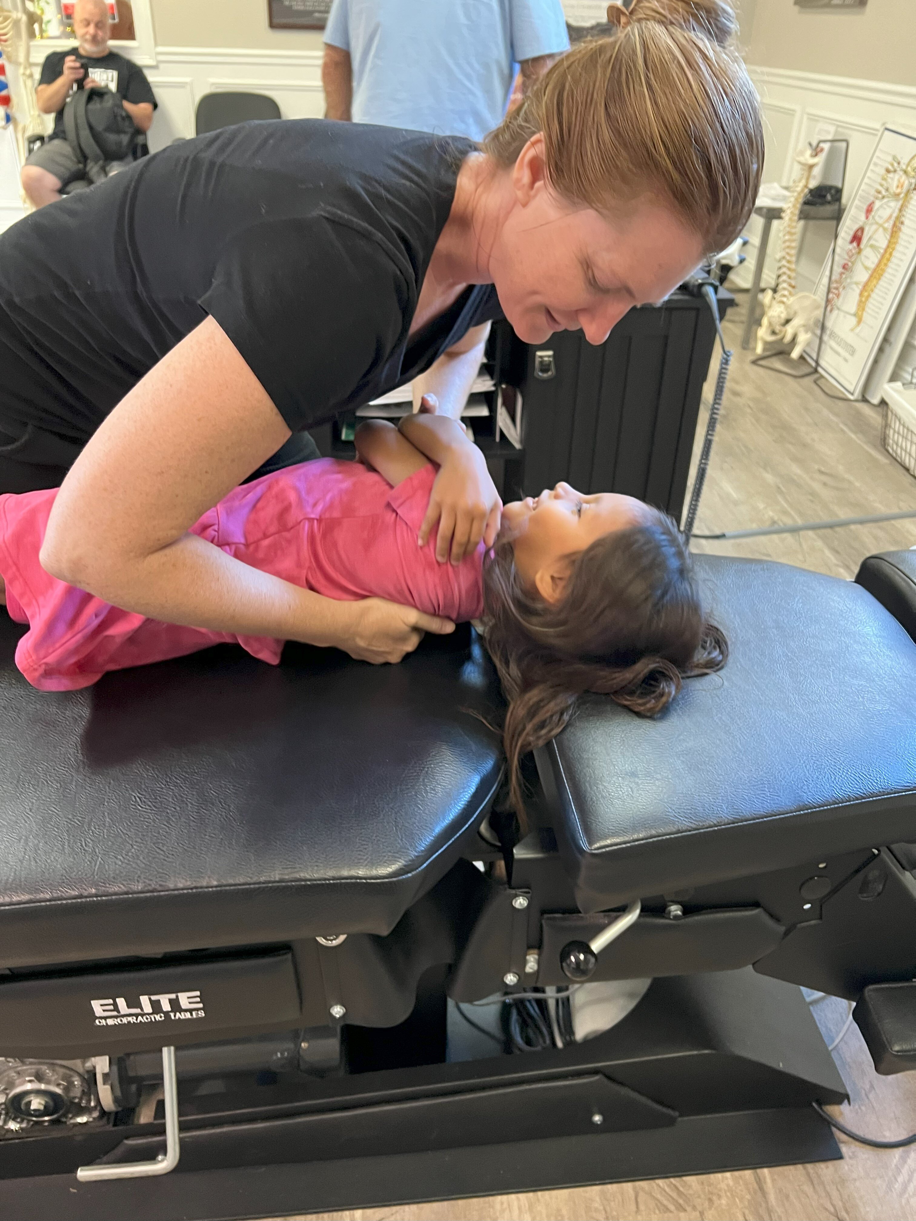 Dr. Carly Smith with a Pediatric Patient using a Drop Table