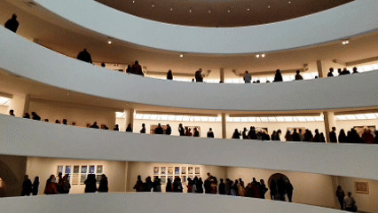 Visitors walking along the curved ramps inside the Guggenheim Museum in New York City ©Stephanie Dosch | theViatrix Custom Cultural Travel Itinerary