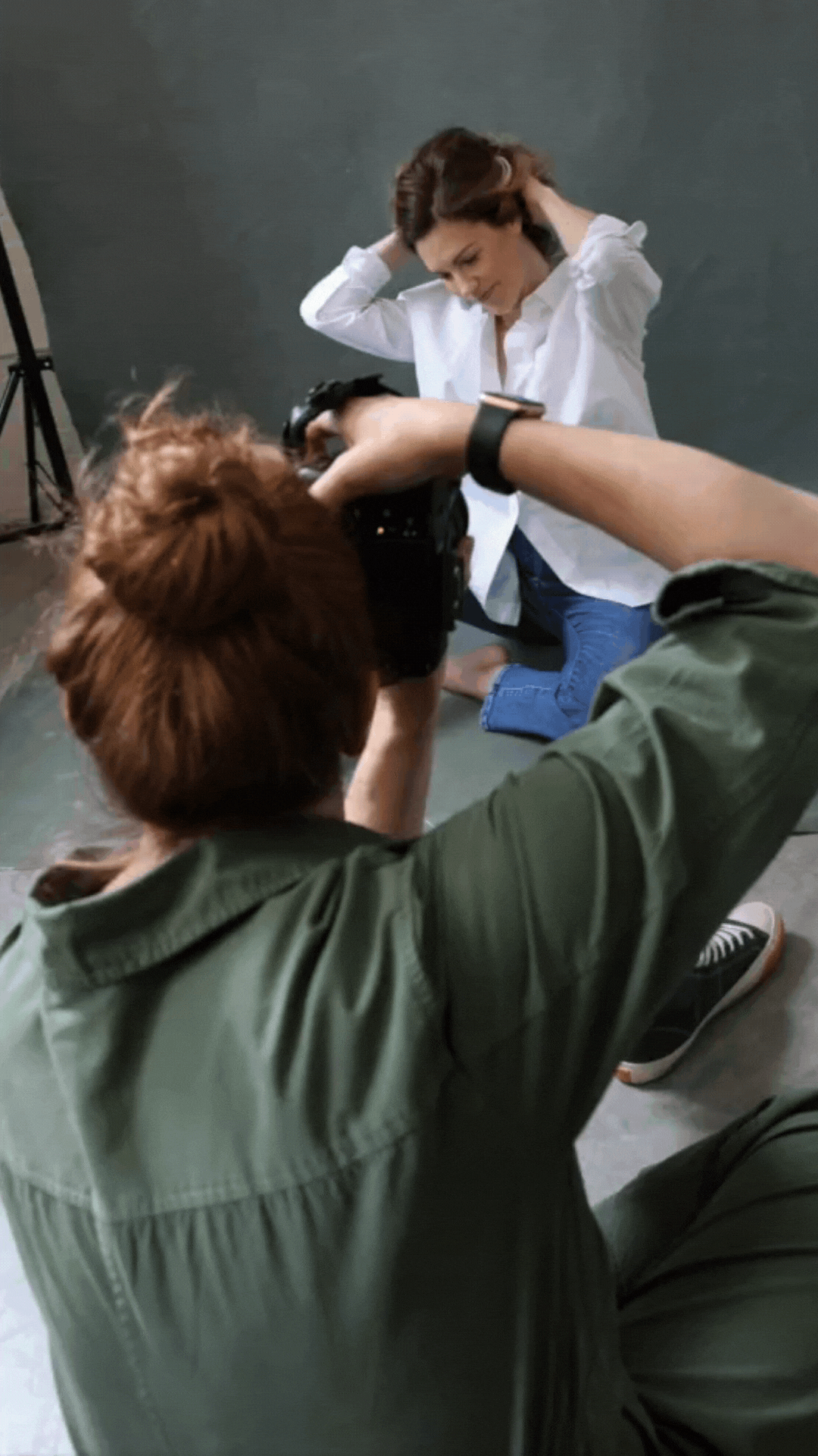 A portrait photographer and her client at a photo shoot in St. Louis Missouri