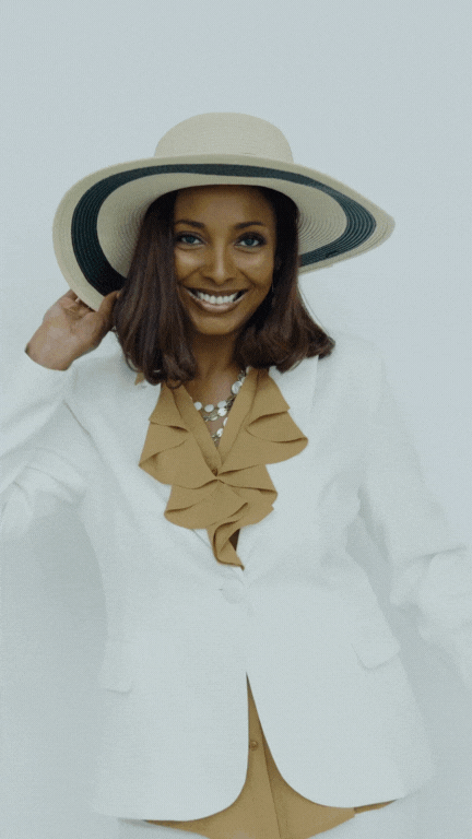 A wedding planner dressed in a white jacket and hat, showcasing sophistication while managing a wedding.