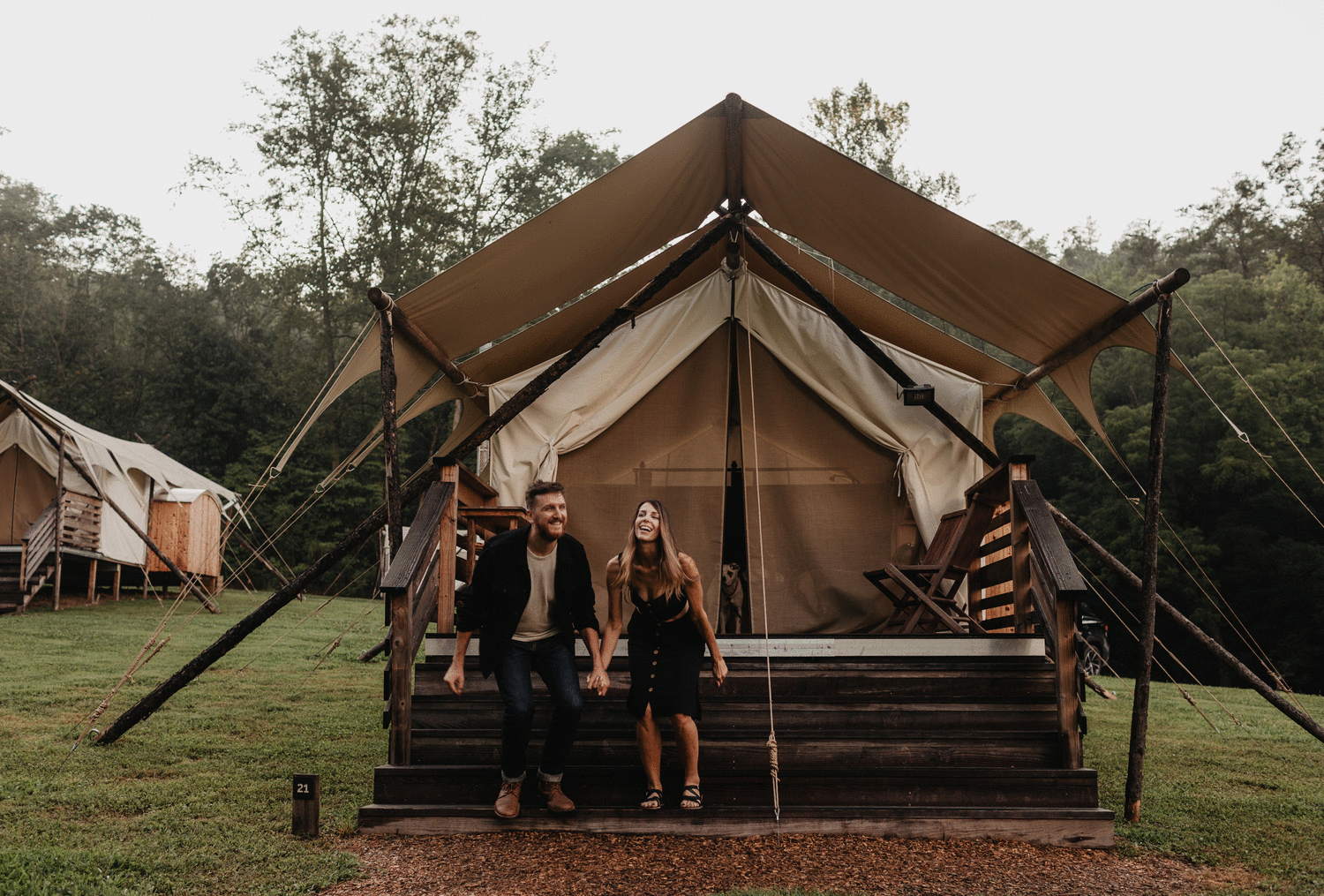 Newly engaged couple jumping gif in front of glamping tent after proposal at Under Canvas in the Smoky Mountainsing in Central Park