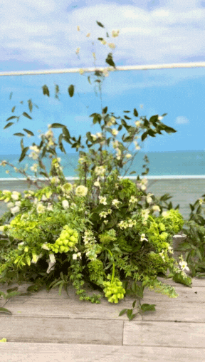 Gif of Floorpiece for the wedding of Jessica and Branden. Light green, dark green and some sparse white flowers.