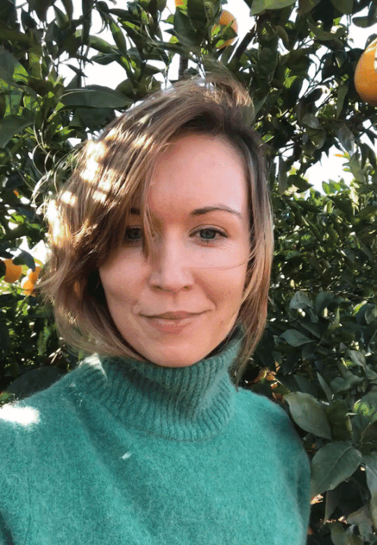 girl in an orange grove
