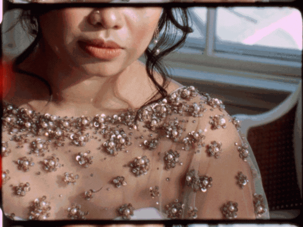 16mm film GIF with a beautiful red film burn, up close detail shot of bride’s dress with lots of beading at Linden Place in Newport RI