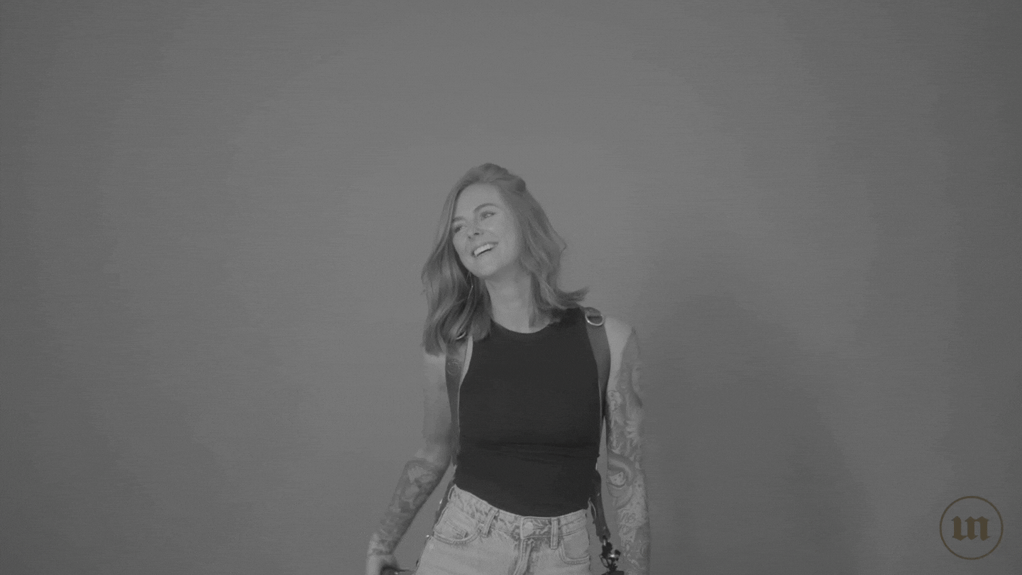 moving GIF of Britt, founder of Uncommon, posing with her camera