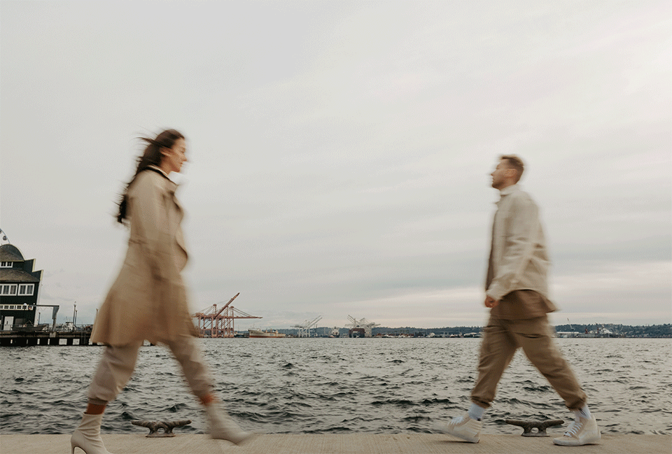 couple walking on a pier