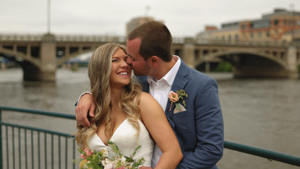 A Couple kissingon a bridge in Michigan