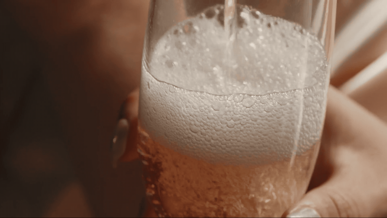 GIF of champagne being poured into a glass 