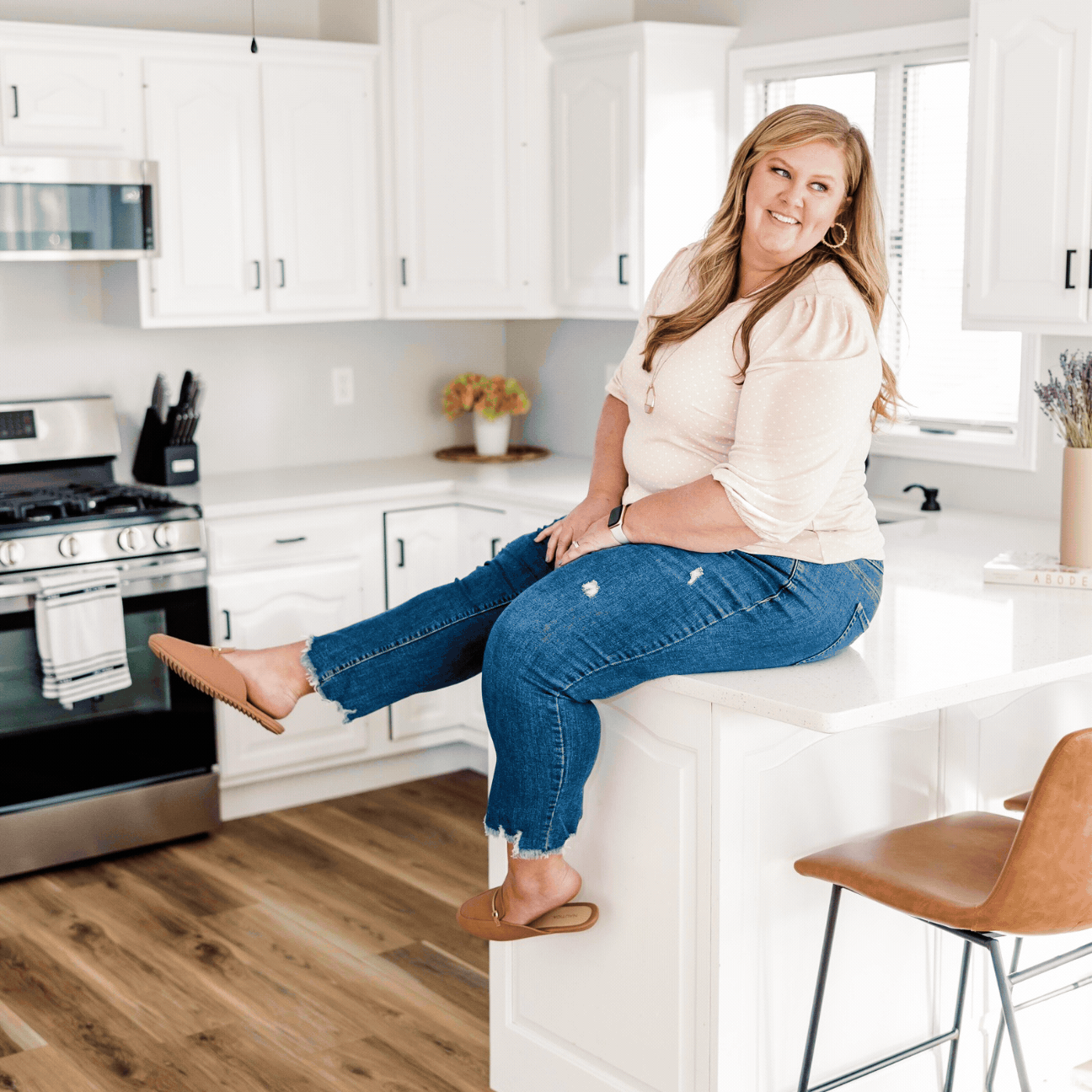 A lively GIF capturing a behind-the-scenes moment with Meg Williamson laughing behind the camera. This candid shot showcases the fun and energetic atmosphere during a photoshoot, reflecting Meg's approachable and passionate style.