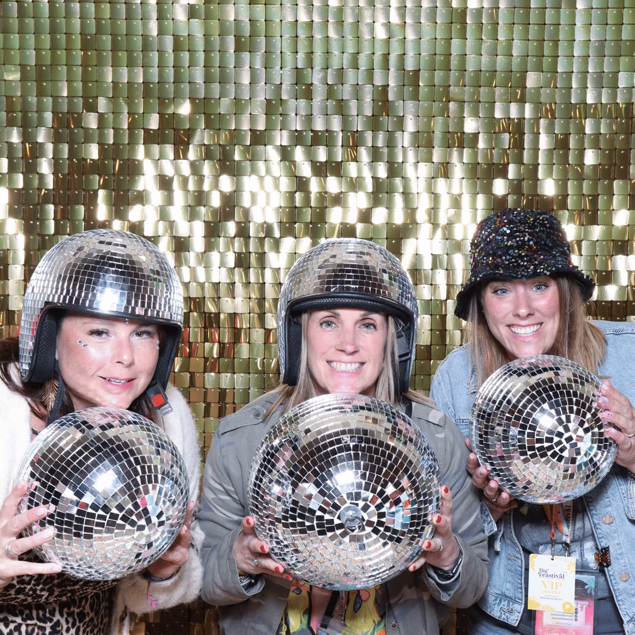 The Big Feastival fun gif with 3 ladies holding disco balls in their hands, posing against a shimmer wall backdrop