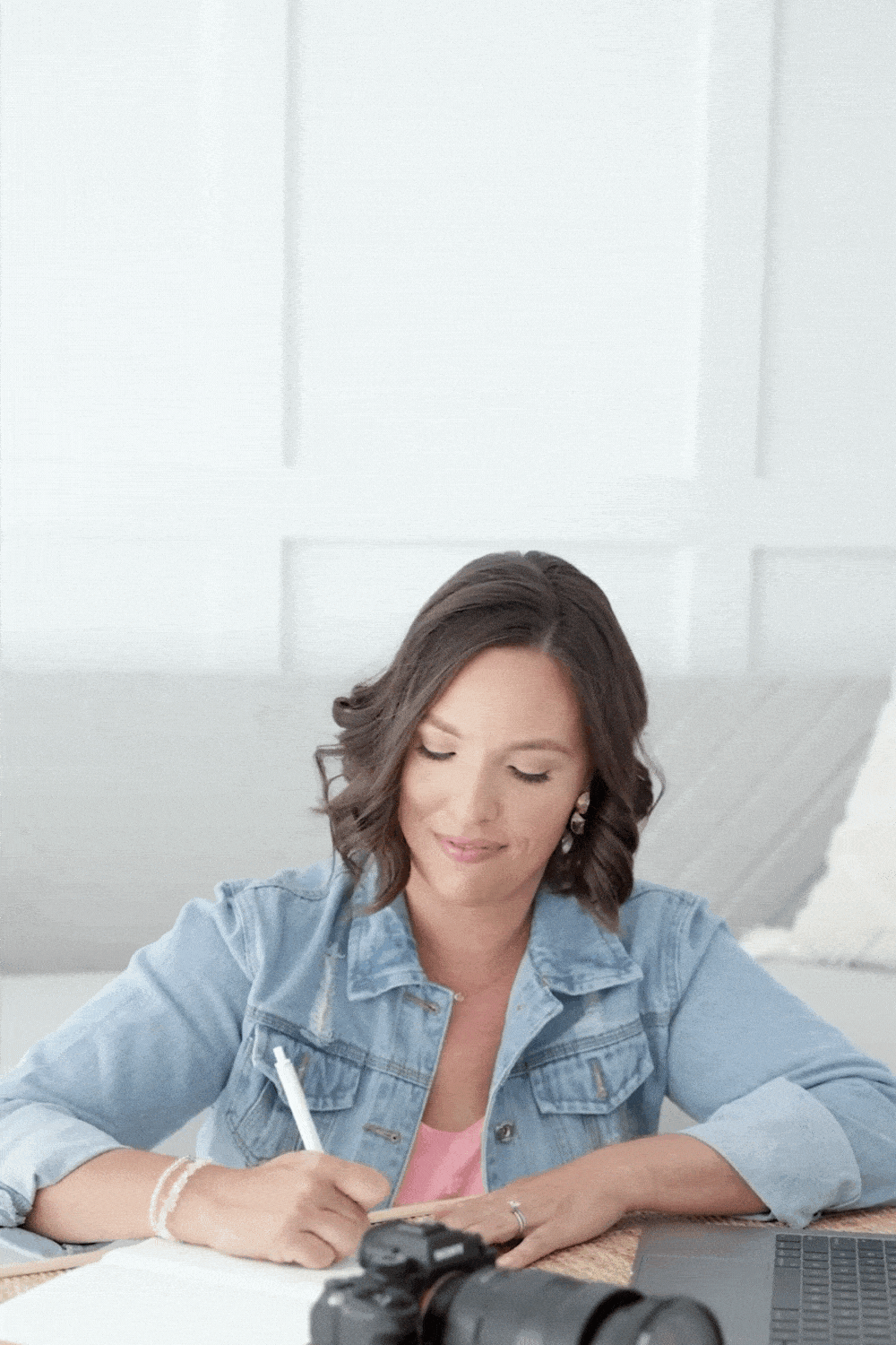 business woman writing in a journal gif