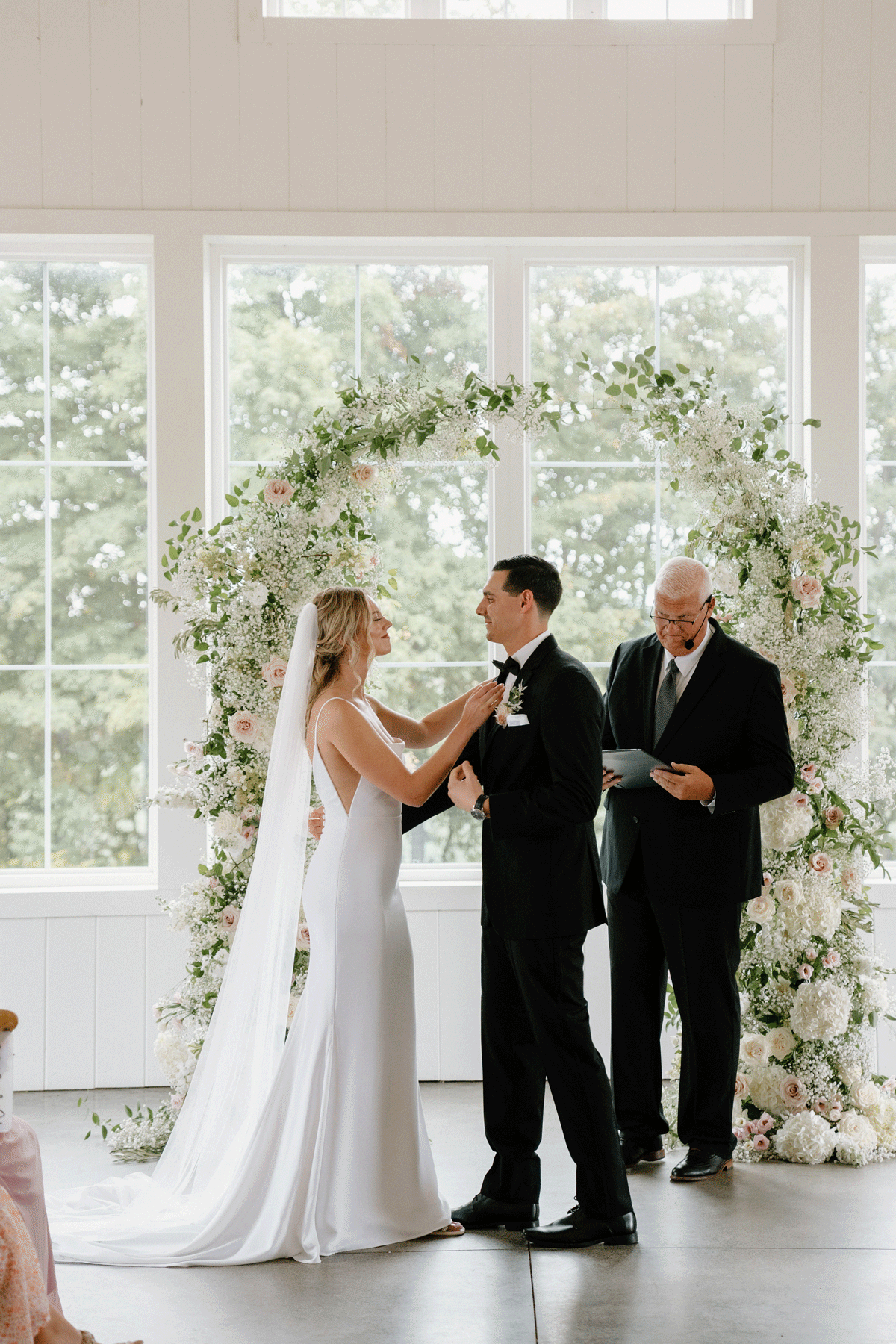 Husband and wife popping champagne