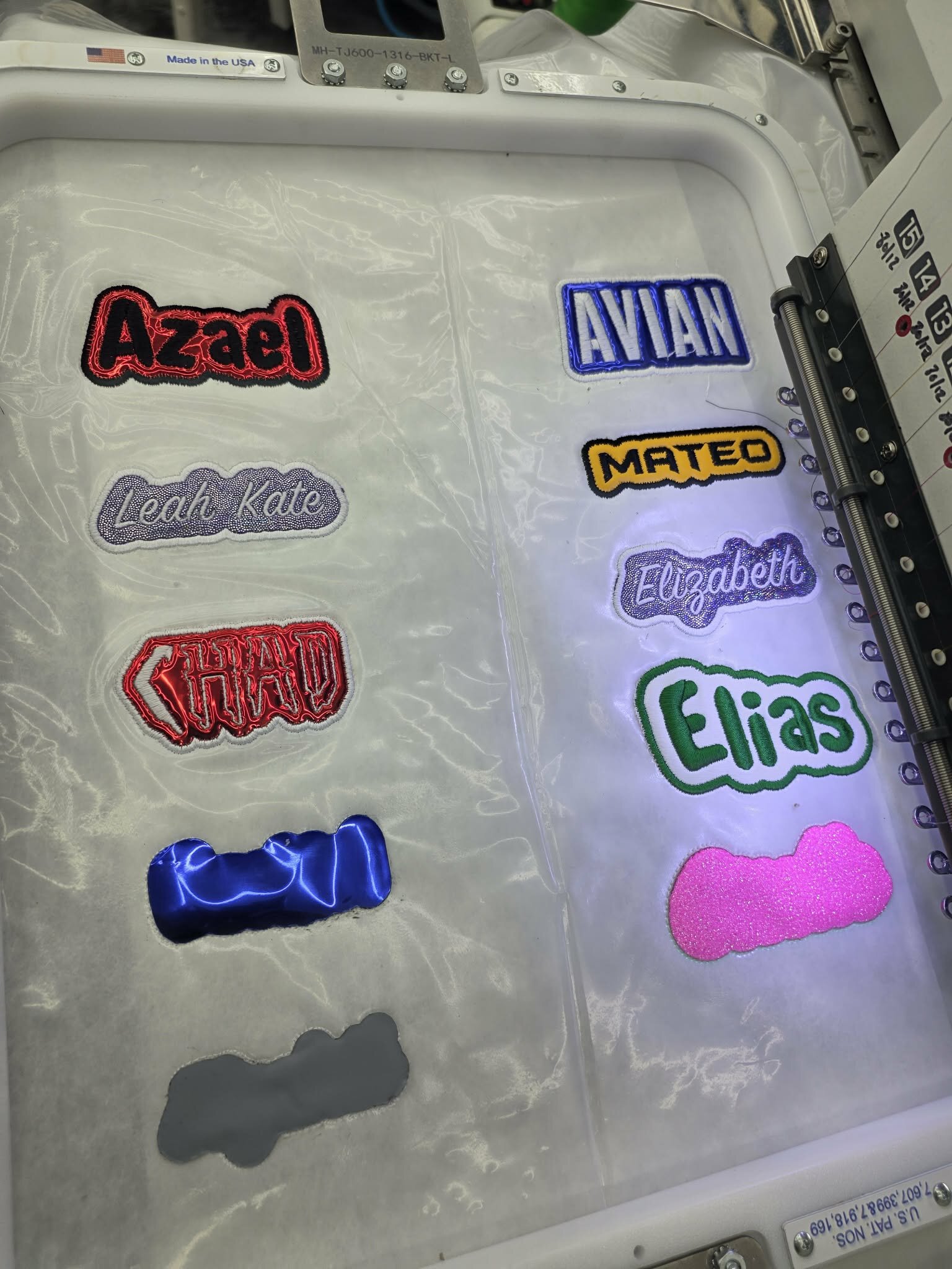 Custom patches on hats by Hat Stitch Katy TX