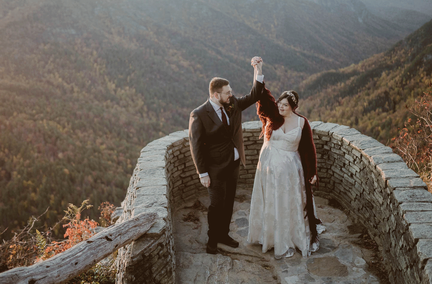 Couple holding hands and smiling on their elopement day after their ceremony