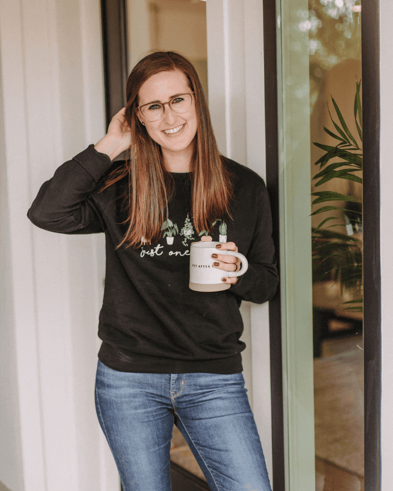 Headshot gif of Liz Strong smiling holding coffee mug