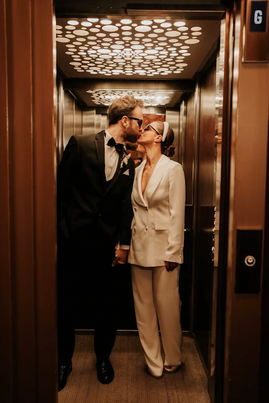 couple kissing in the elevator