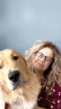 gif of woman hugging golden retriever dog