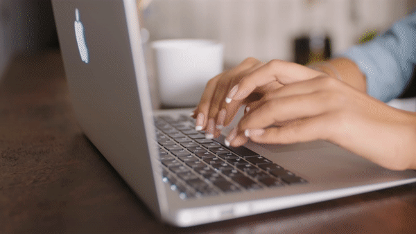 Animated image of website designer fingers typing on a keyboard