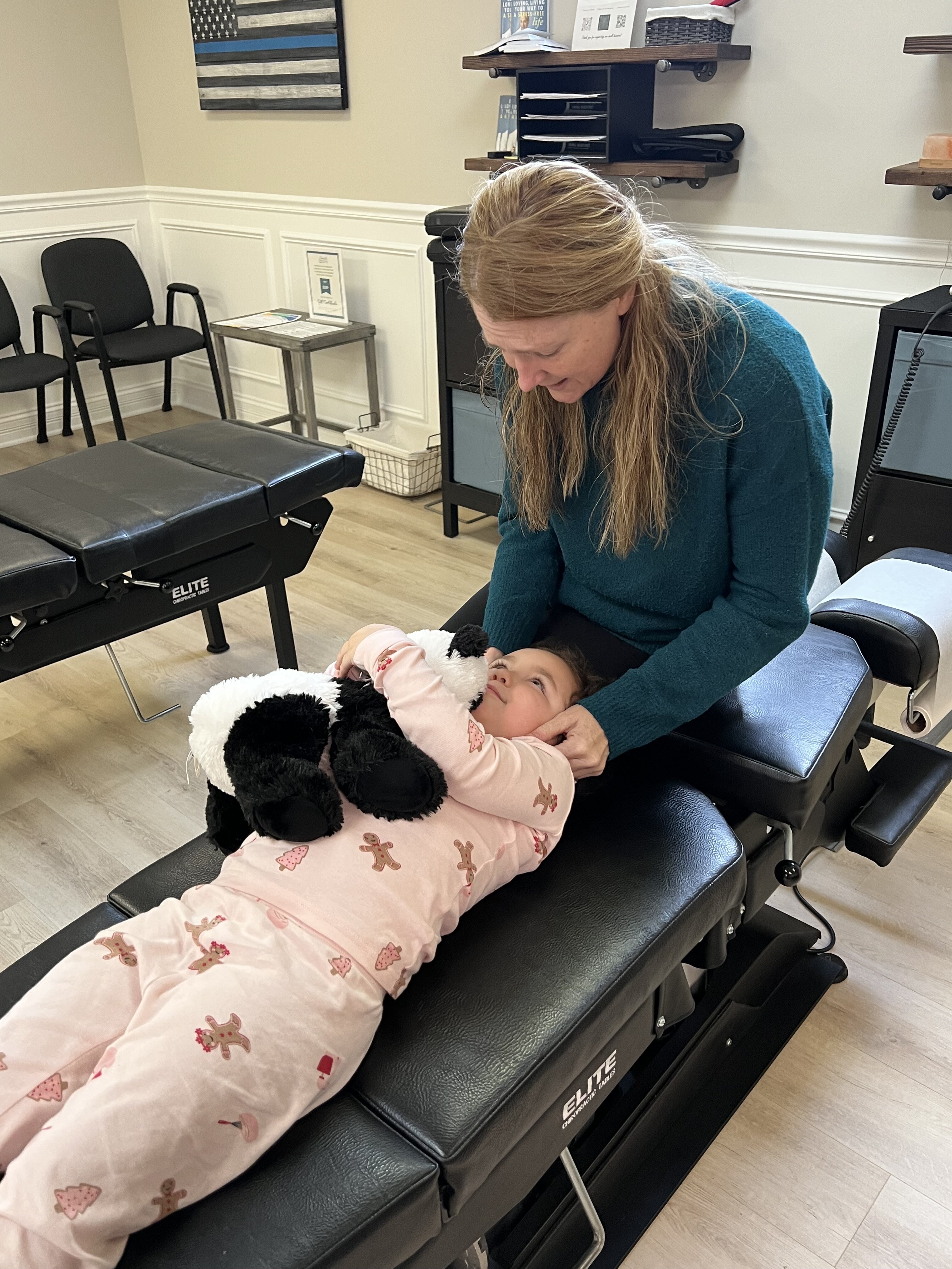 Dr. Carly Smith provides chiropractic care to young child