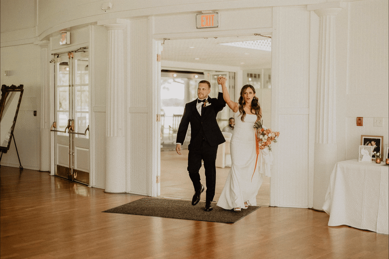 GIF of bride and groom entering wedding reception