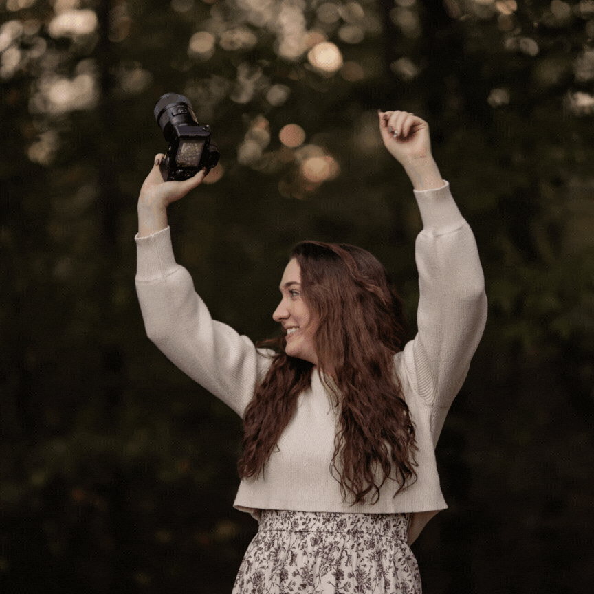 Leah Wedding Photographer dancing while holding her camera and smiling into the frame at the end.