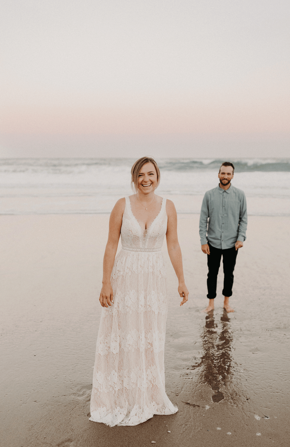 moving GIF of a Bride & Groom having fun on the beach