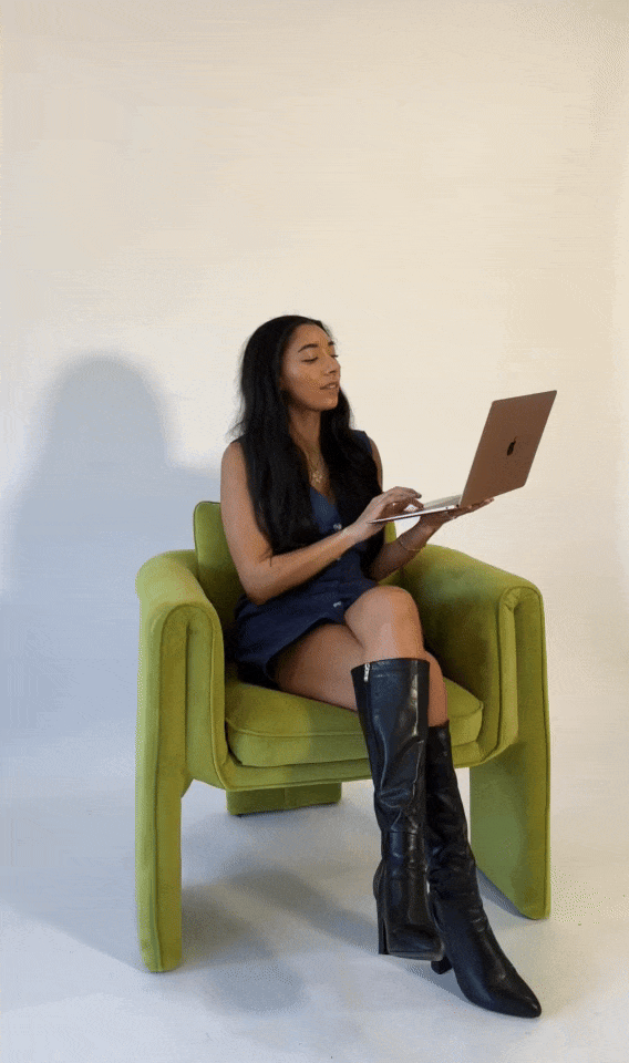 Bri holding a laptop and smiling, celebrating her fast and strategic Website in a Week service