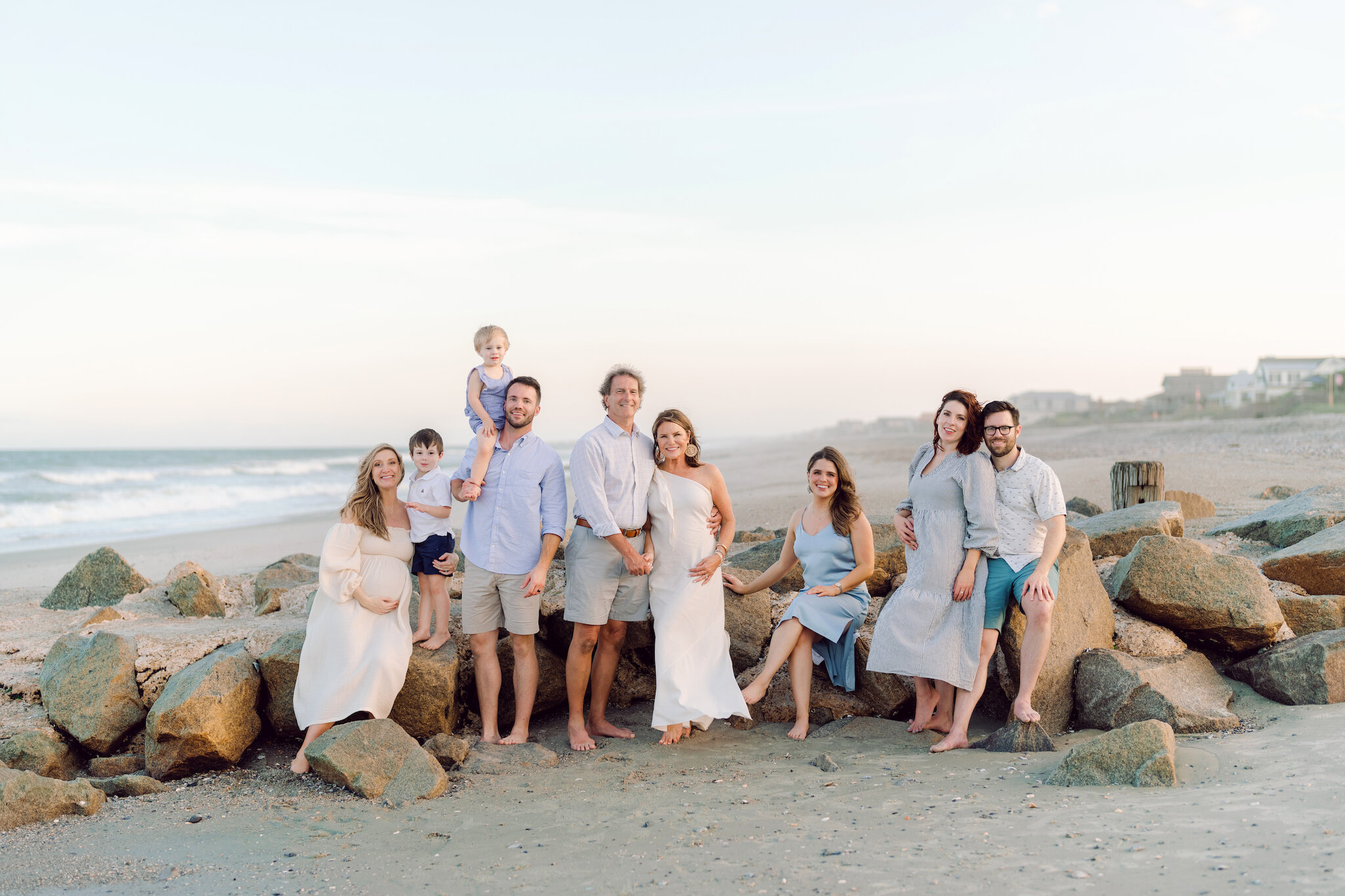Myrtle Beach Family Photographer - Family Sitting on the Rocks during Photoshoot in Myrtle Beach