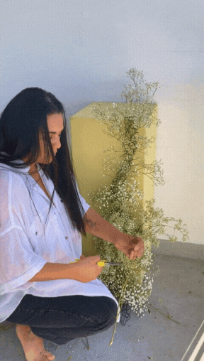 Natalia arranging baby's breath.