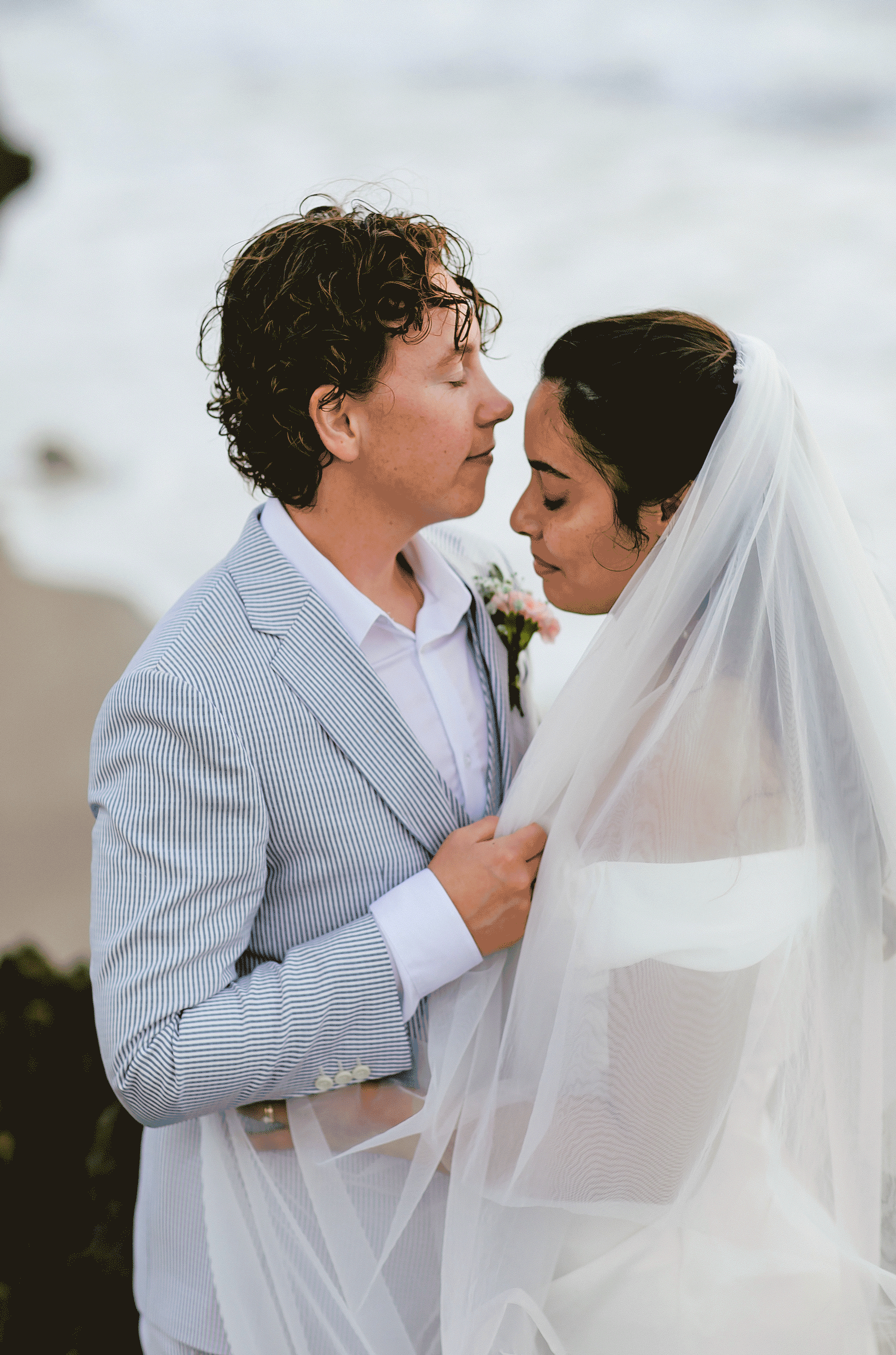 Moving Picture of Queer Couple embracing on their Elopement Day