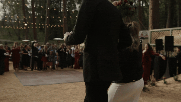 bride and groom running to reception by miami wedding videographer