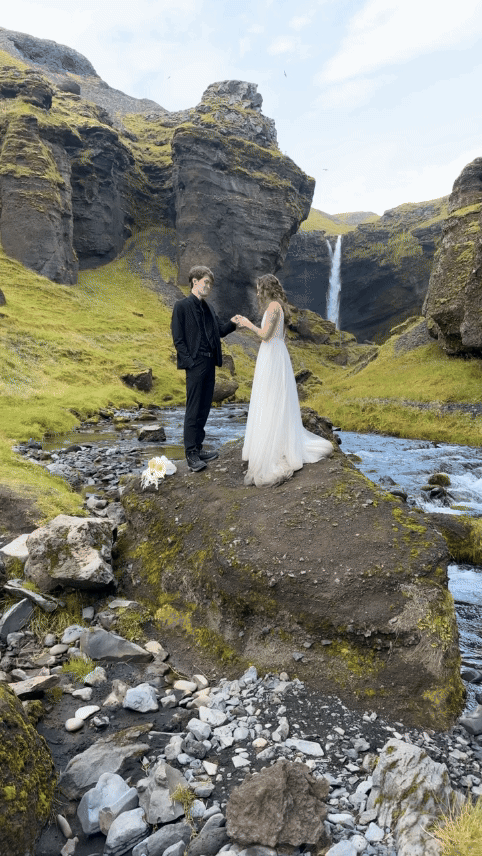 couple eloping under waterfall in iceland