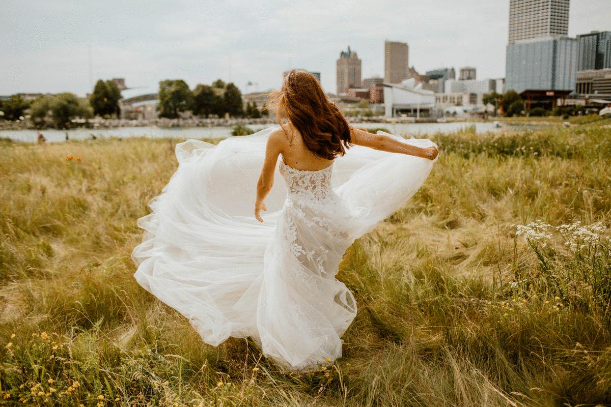 Bride twirling in field
