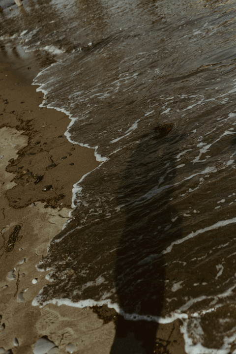 gif of water crashing on the beach