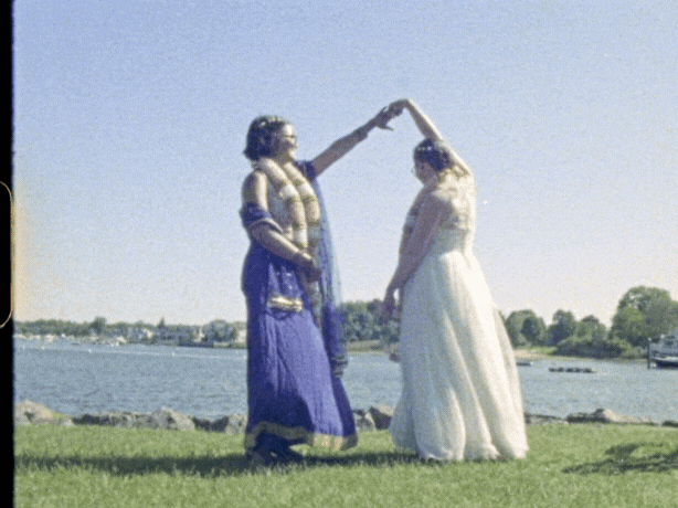 Super 8 film of a bride and groom cutting their cake at their winter wedding at Willowdale Estate — captured by a vintage wedding videographer at Castillo Holliday Photo + Film.