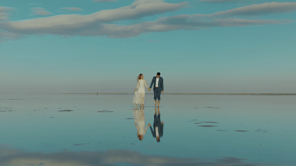Sunset Elopement at the Salt Flats in Utah with water reflections